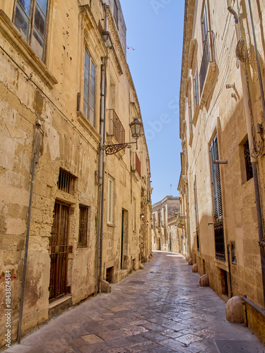 Charming cobblestone alley with stone houses. Lecce, a baroque city in Salento, Apulia, Puglia, Italy, Europe