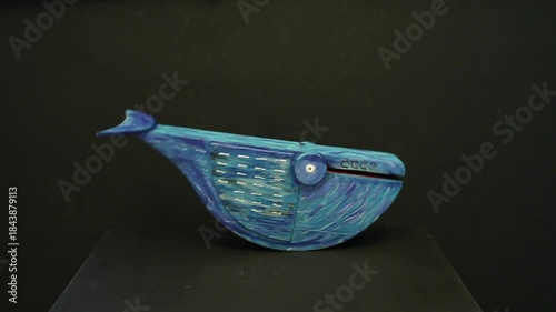 blue whale snaps its mouth and rocks back and forth