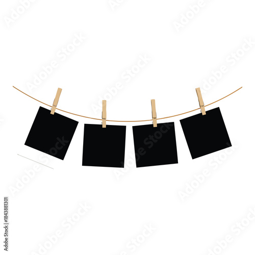 Four black notes hanging on a clothesline