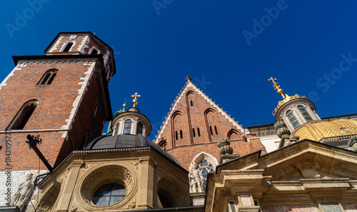 Decorations of Wawel Cathedral. The tops of architectural buildings of different styles of Wawel Cathedral and the bell tower
