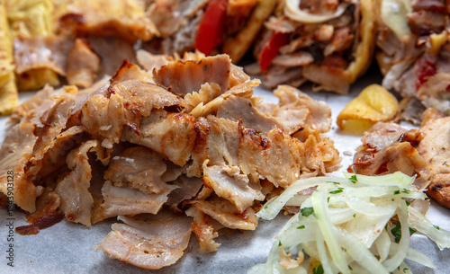 Fototapeta Naklejka Na Ścianę i Meble -  Gyro sliced meat closeup, doner shawarma wraps, traditional greek street food