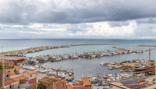Принти на полотні Busy Mediterranean Fishing Port with Historic Town and Breakwaters, Sciacca, Sic