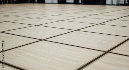 Elevated perspective of sprung floor panels systematically connected in a grid ready for ballet or contemporary dance rehearsals.
