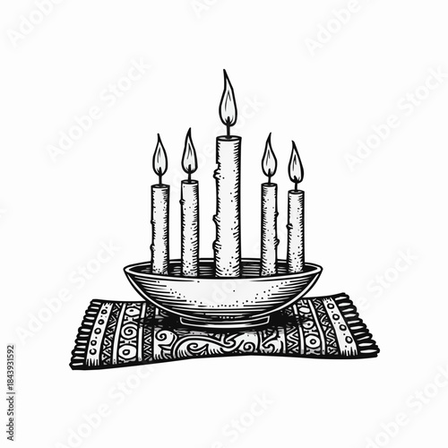 Kinara with five candles on decorative cloth representing Kwanzaa  
