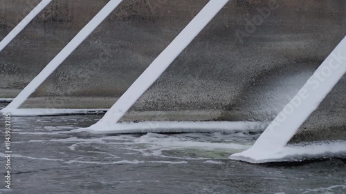 water flowing from spillway with audio in winter