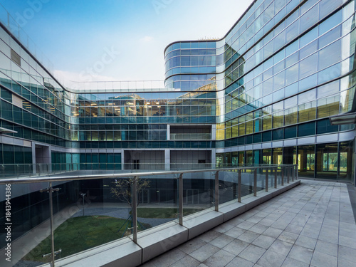 Captivating Modern Architecture with Gleaming Glass and Serene Courtyard Space