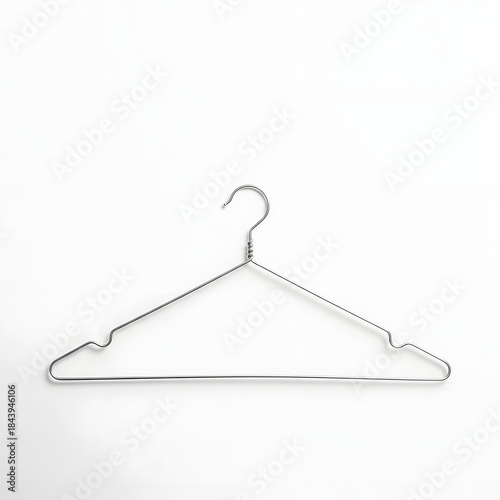 Simple metallic silver wire clothes hanger isolated on white background, laundry, closet organization, clothing, minimal