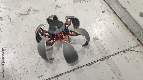 Moving small robot on remote control. Radio controlled robot. Small robot folds into ball and moves on blades. Technology engineering. Industry new robotics. Smart technologies. Robotized innovative