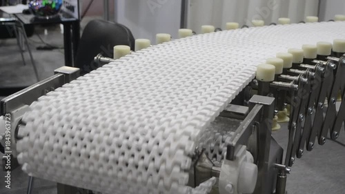 Modular belt rotary conveyor. Continuous movement system. Transportation of materials or products. Conveyors for moving objects. Production manufacture. Moving industrial belt. Connected plastic links