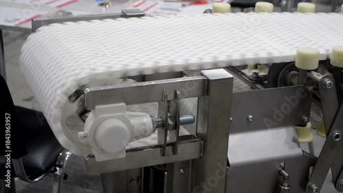 Modular belt rotary conveyor. Continuous movement system. Transportation of materials or products. Conveyors for moving objects. Production manufacture. Moving industrial belt. Connected plastic links