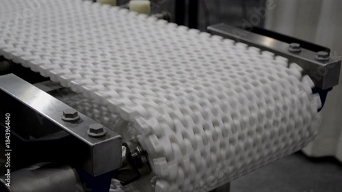 Modular belt rotary conveyor. Continuous movement system. Transportation of materials or products. Conveyors for moving objects. Production manufacture. Moving industrial belt. Connected plastic links