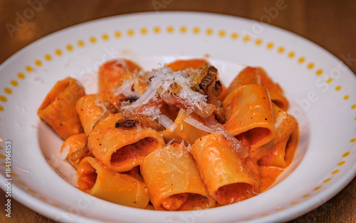 Thick Paccheri pasta Zozzona with pancetta and cheese in Zurich, Switzerland
