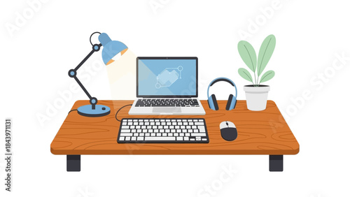 Modern workspace with laptop, lamp, and plant on wooden desk