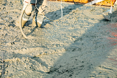 Fresh Concrete Pouring on Road Construction Site