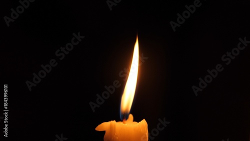 Candle Flickers Through Stormy Darkness, Gentle Flicker Symbolizes Strength In Shadowed Darkness, Wavering Candle Flame Showcases Resilience During Storm And Power Loss Situations