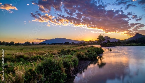 Serene Sunset Over Still Waters - A Landscape of Tranquility and Reflection.