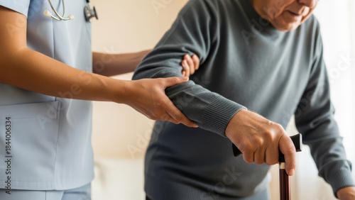 Nurse assisting elderly patient with a walking cane in a caring environment.