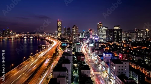 Wallpaper Mural Vibrant Cityscape At Night With Streaking Car Lights Over A Bridge And River Reflecting City Glow Torontodigital.ca