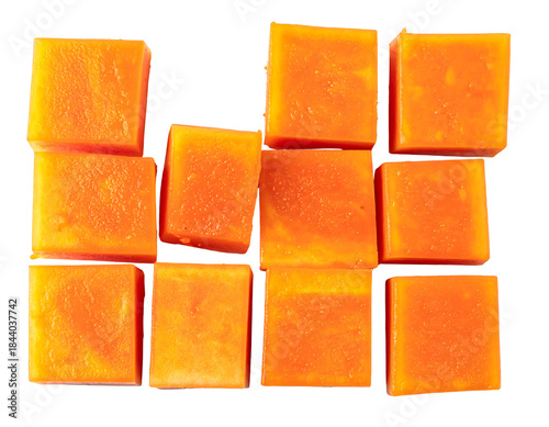 A collection of perfectly cut, vibrant orange cubes of mango, arranged in a visually appealing pattern on a white background.