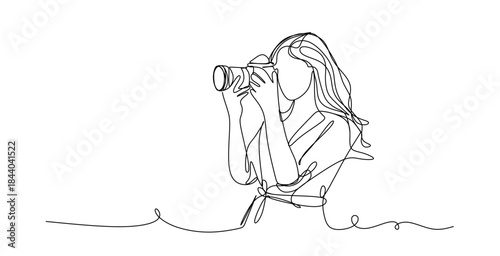 Continuous line drawing of a woman holding a camera up to her face taking a photograph in black and white