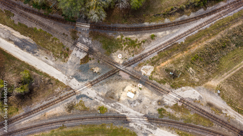 Fotografia Aerial photo of railroad tracks crossing, intersecting, each other near a rural switching yard