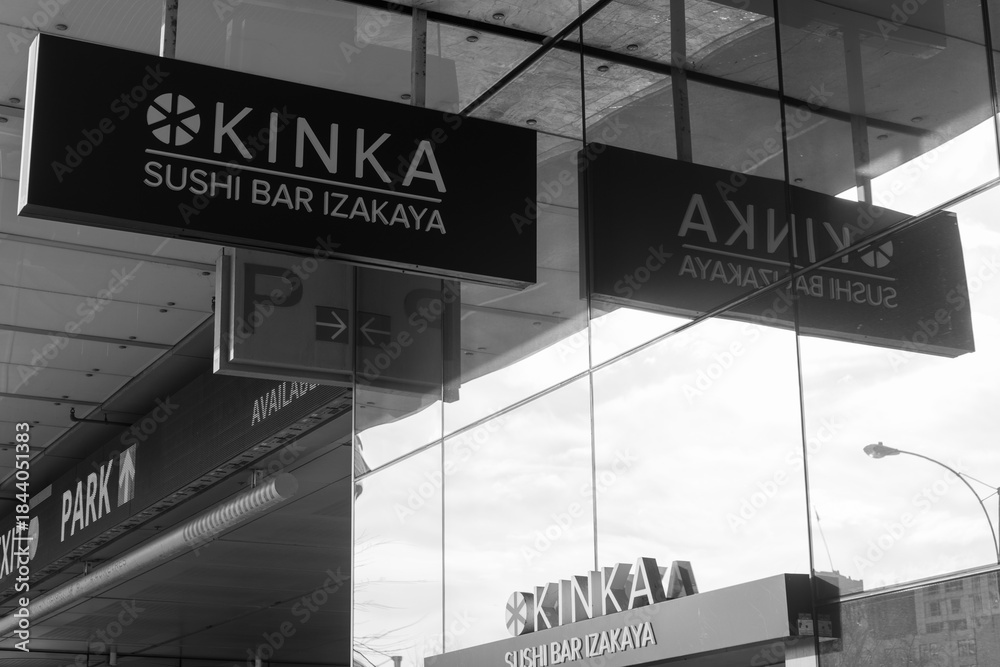 Fototapeta premium black and white representation of hanging sign over entrance to Kinka Sushi Bar Izakaya Harbourfront located at One York Street, 110 Harbour St, Toronto