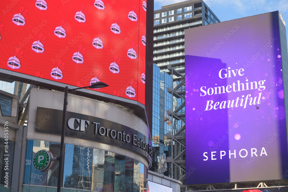 Naklejka premium exterior building facade and sign of CF Toronto Eaton Centre incl digital advertisements for Sephora, facing Sankofa Square, Toronto