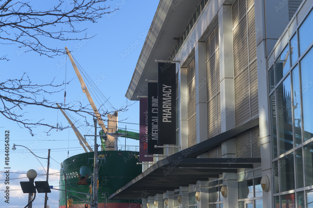 Naklejka premium hanging banners outside Loblaws Lower Jarvis Street with cargo vessel Labrador at Redpath Sugar Refinery, Toronto