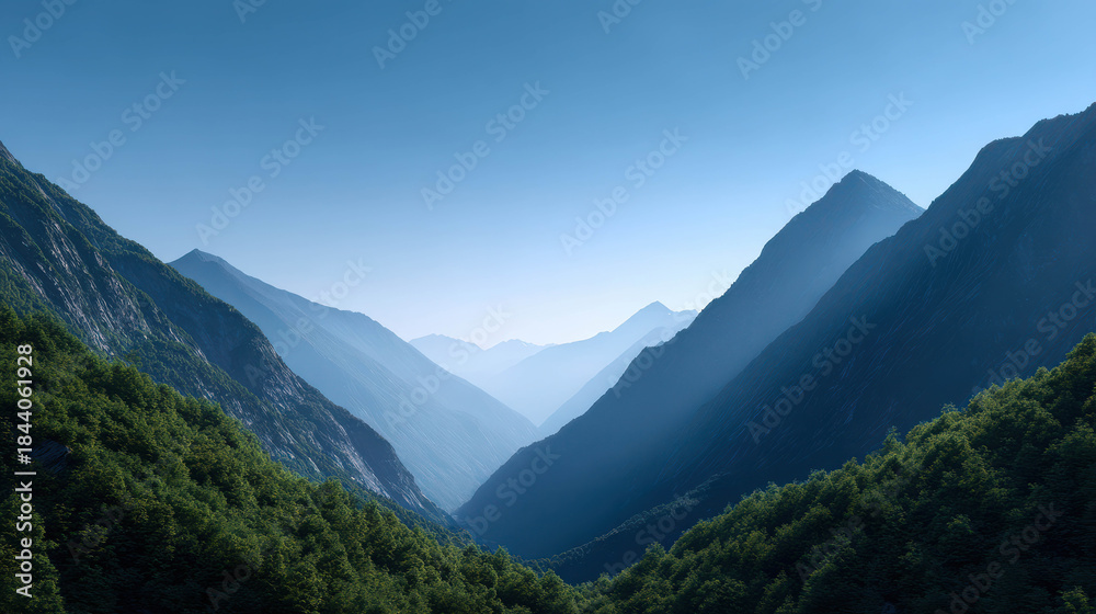 Fototapeta premium Majestic Valley Surrounded by Distant Mountain Silhouettes Under Clear Sky and Soft Light, Capturing the Essence of Natural Beauty and Tranquility