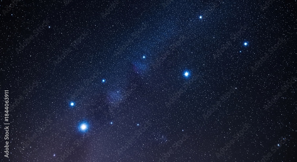 Fototapeta premium The night sky with the Orion constellation visible through a telescope.