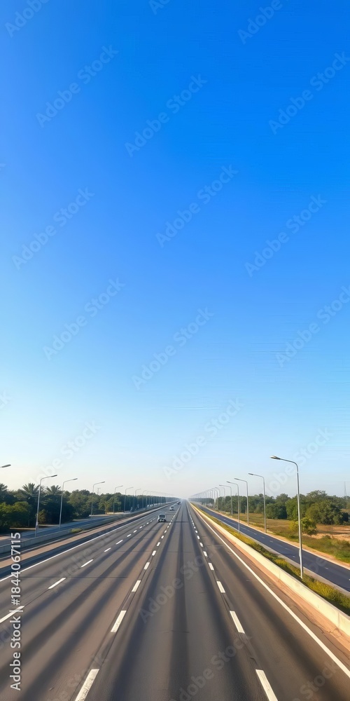 Fototapeta premium Vast, car-free highway under a clear blue sky, highway, day
