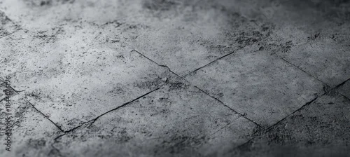 Panel kuchenny z motywem close up of old textured concrete floor with visible cracks and grainy surface in grayscale