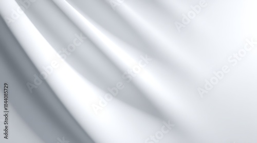 Abstract white silk fabric waves with soft light and shadow creating a clean minimalist background texture