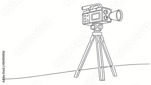 Professional video camera set up on a tripod, ready to capture the moment.