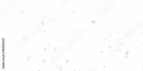A white grainy texture with scattered dark speckles across a neutral background