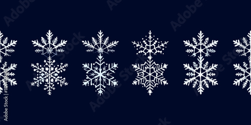 Detailed illustration of various white snowflake designs on a dark blue background