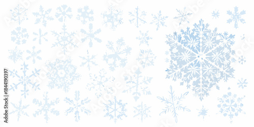 A collection of delicate light blue snowflakes scattered on a white background
