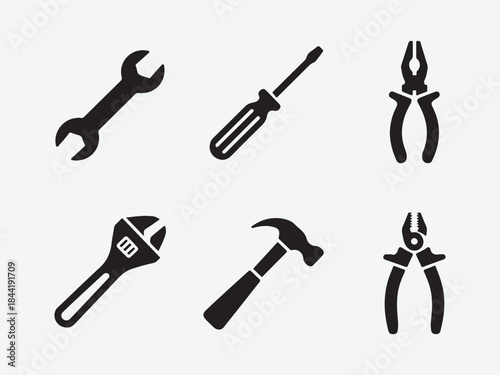 Set of black silhouette icons of hand tools, Collection of silhouetted hand tools including wrenches screwdrivers pliers hammers and saws vector illustration