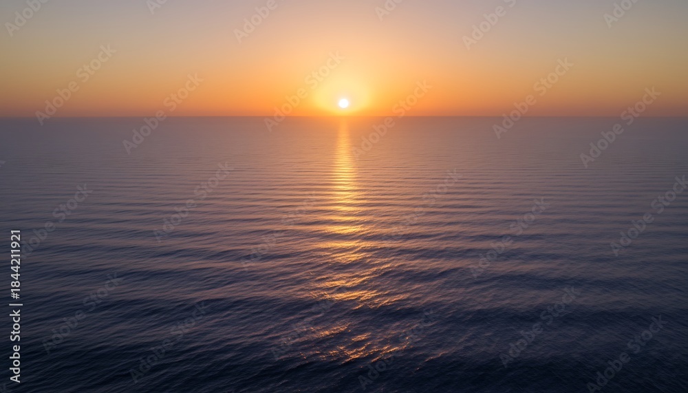 Obraz premium Ocean sunset horizon with calm waves and warm golden light for travel branding, wellness backgrounds, minimalist design, and serene coastal themes