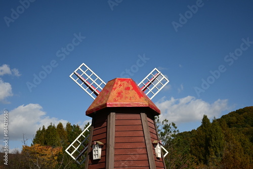 Traditional Windmill Structure against Blue Sky