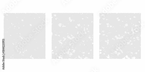 Three gray rectangular panels with varying degrees of speckled texture