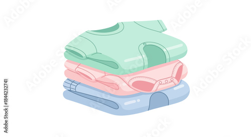 Stack of folded baby clothes in green pink and blue colors
