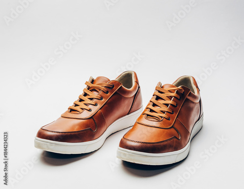 White leather fashion sneakers, a pair of new footwear isolated on white