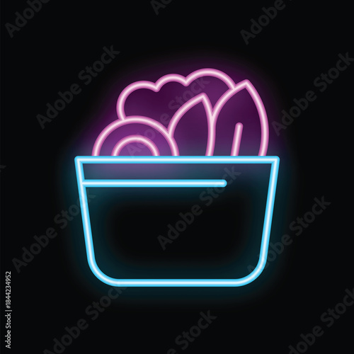 Neon sign illuminating a salad in a bowl, perfect for healthy food businesses