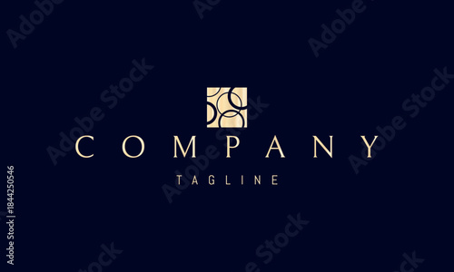 A vector golden logo featuring an abstract image a square containing multiple circles arranged in a clean geometric pattern.