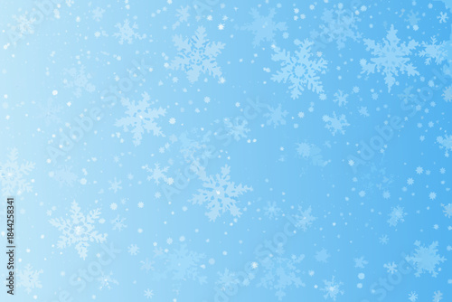 A serene winter background featuring delicate snowflakes on a pale blue canvas