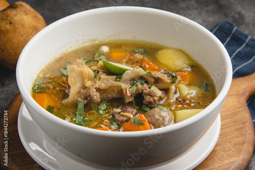 Foto Delicious Oxtail Soup with Vegetables in a White Bowl.