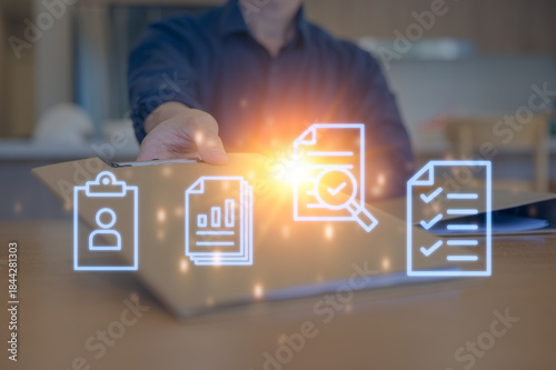 Close-up of a businessperson's hand reaching for a confidential folder on an office desk, symbolizing urgency, data handling, document management, and business communication in the workplace