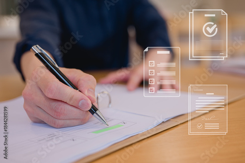 Closeup hand photo of Business professional carefully signing important documents using pen sitting in modern office table, writing and sign an agreement