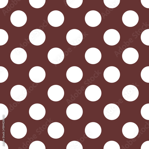Seamless vector pastel pattern with big white polka dots on a dark brown background. For decoration, desktop wallpaper or autumn website design